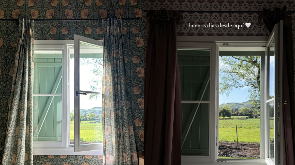 La paredes está empapeladas con flores románticas y cortinas a juego. La paredes está empapeladas con flores románticas y cortinas a juego.