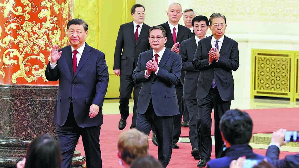 Xi Jinping (izquierda)