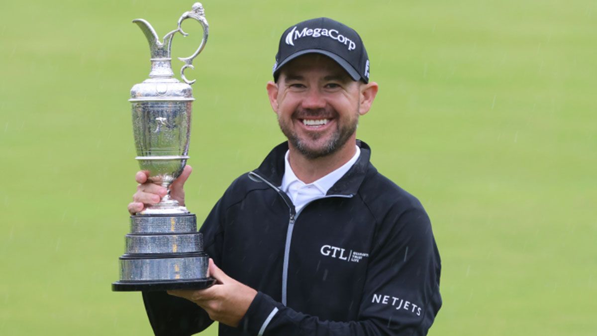 Harman con la legendaria Claret Jug Harman con la legendaria Claret Jug