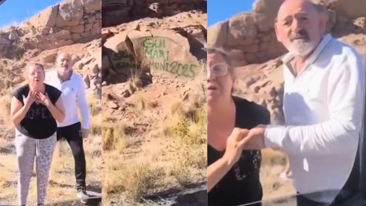 Los turistas que fueron escrachados pintando las rocas.