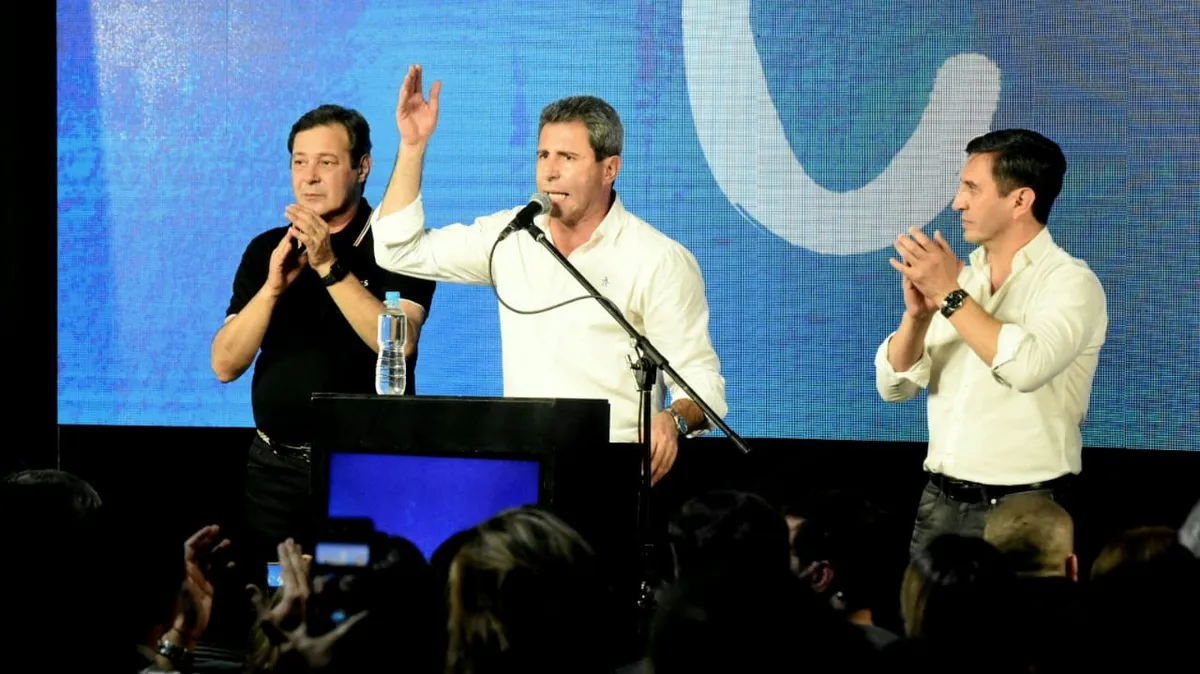Rubén Uñac, Sergio Uñac y Cristian Andino.